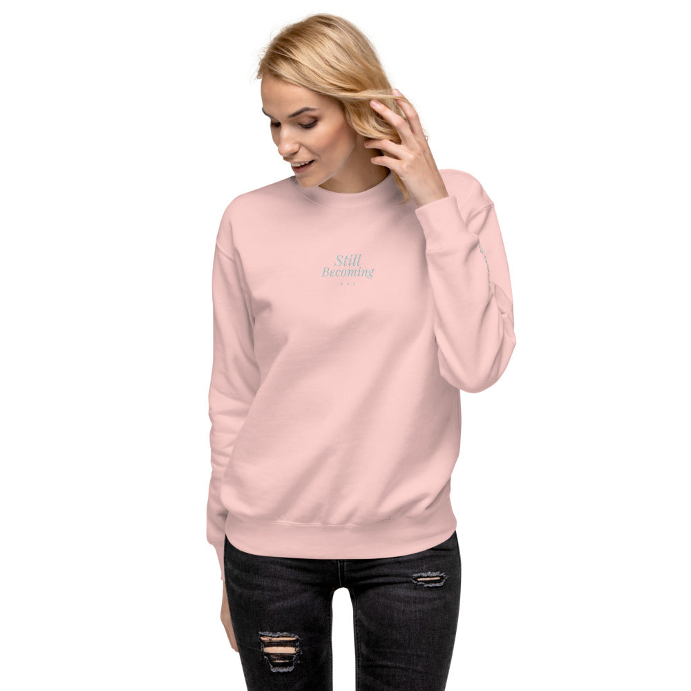 Still Becoming Embroidered Crewneck Sweatshirt in Light Pink, front view, worn.