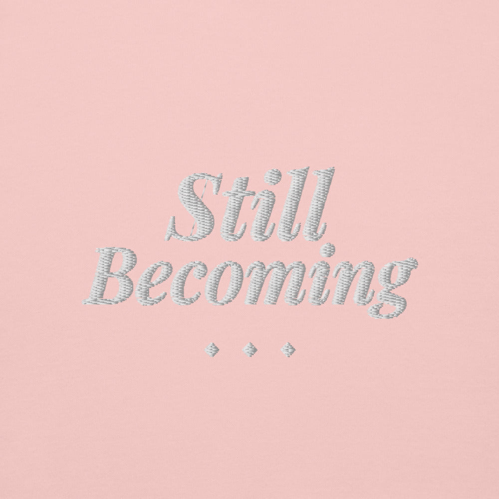 Still Becoming Embroidered Crewneck Sweatshirt in Light Pink, front view, worn.