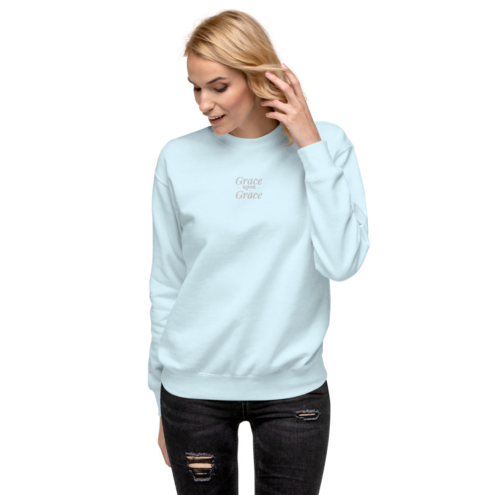 Grace Upon Grace Embroidered Crewneck Sweatshirt in Sky Blue, front view, worn.