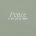 Peace Over Pressure Embroidered Tee in Sage, close-up of the front embroidery.