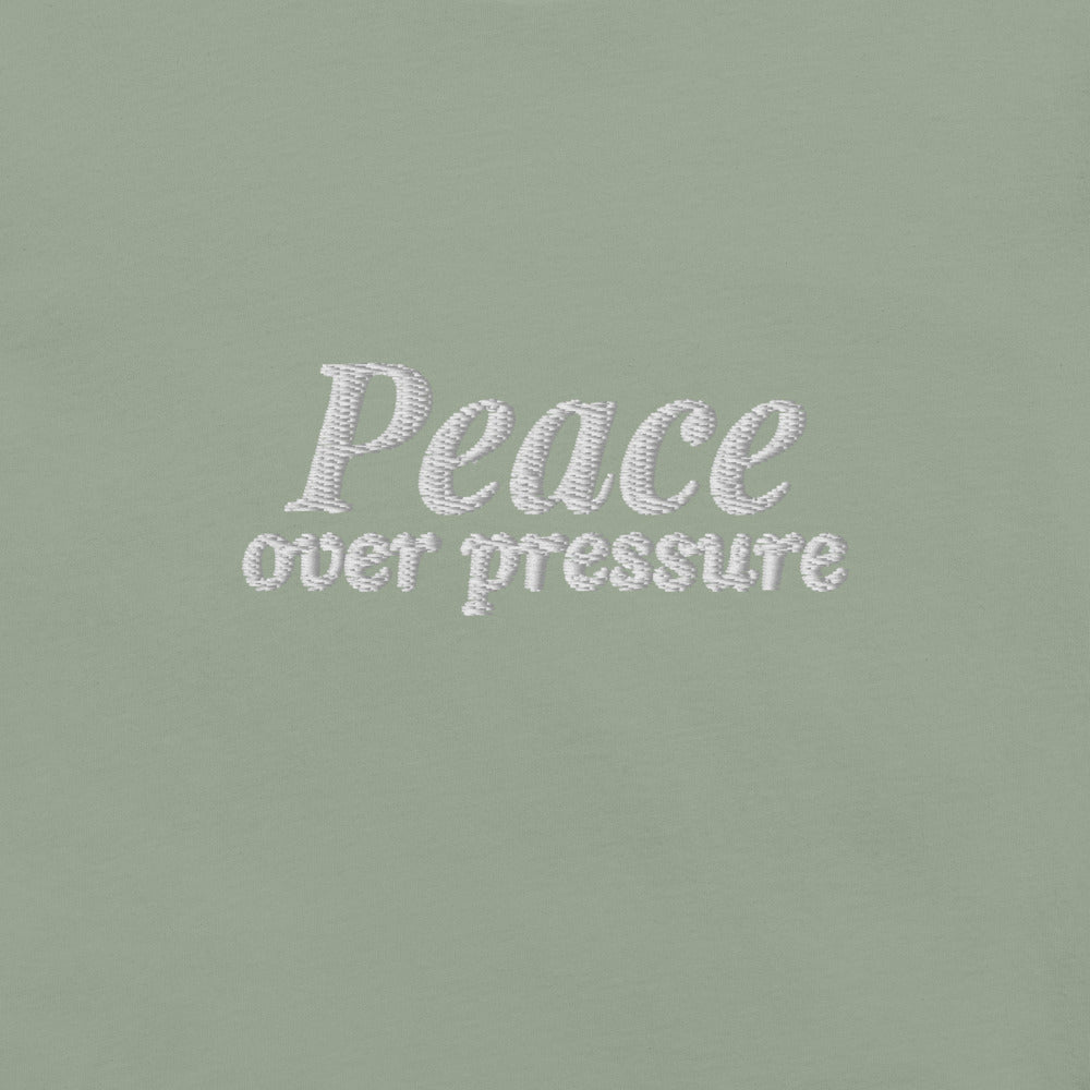 Peace Over Pressure Embroidered Tee in Sage, close-up of the front embroidery.