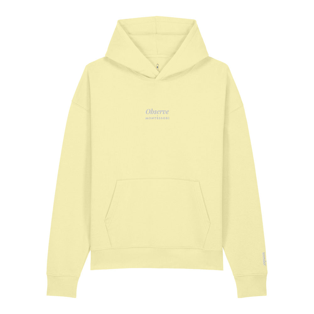 Observe Embroidered Hoodie in Lemon Sorbet, left wrist embroidery.