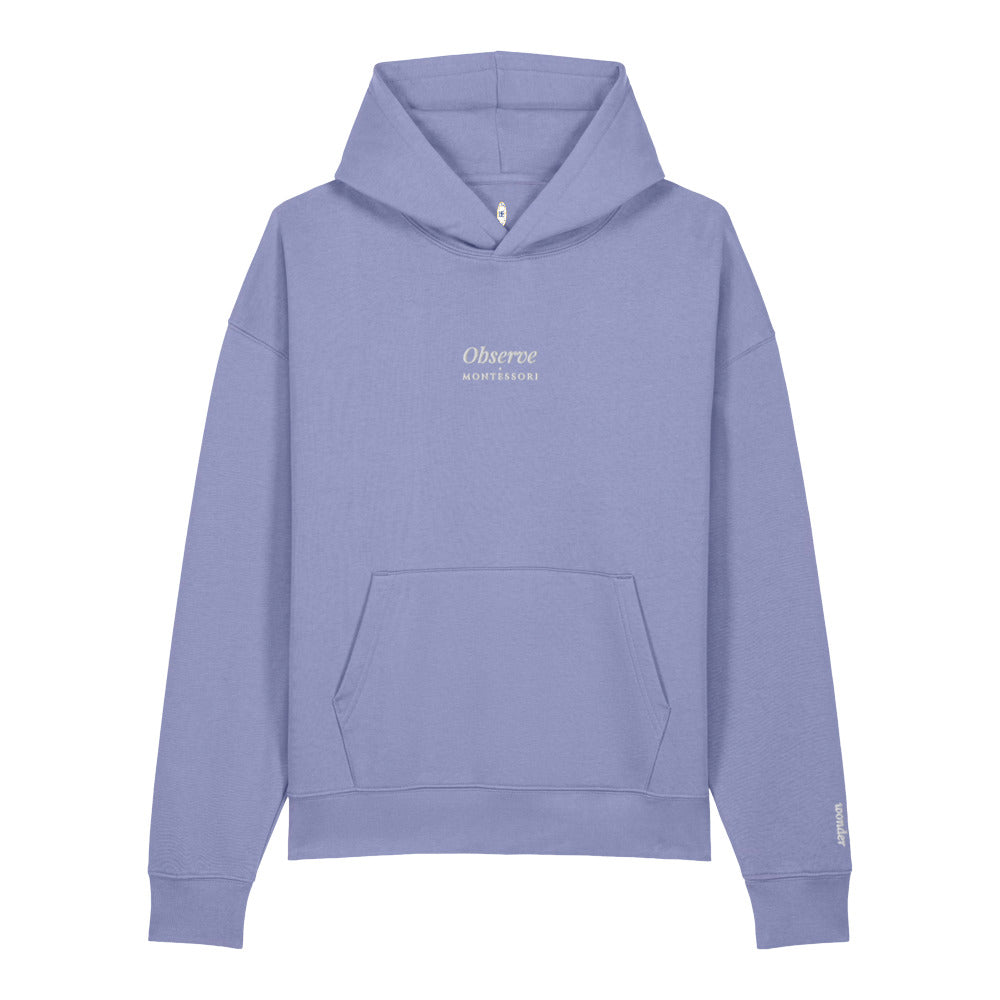Observe Embroidered Hoodie in Violet, close-up of the front embroidery.