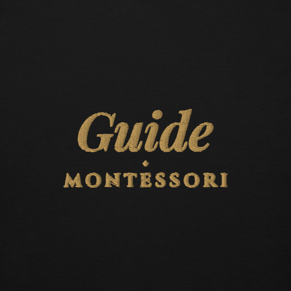 Guide Embroidered Hoodie in Black, front view, worn.