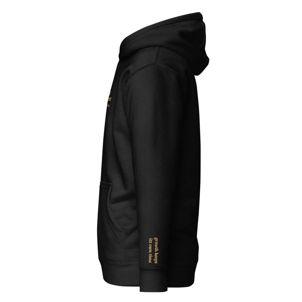 Trust the Process Embroidered Hoodie in Black, left wrist embroidery.