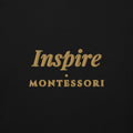 Inspire Embroidered Hoodie in Black, close-up of the front embroidery.