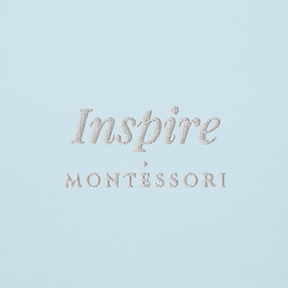 Inspire Embroidered Hoodie in Sky Blue, close-up of the front embroidery.