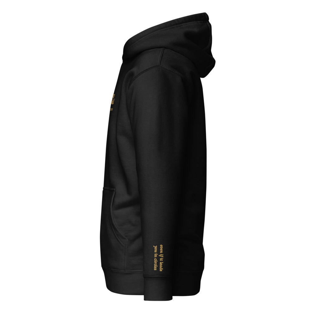 Follow the Child Embroidered Hoodie in Black, left wrist embroidery.